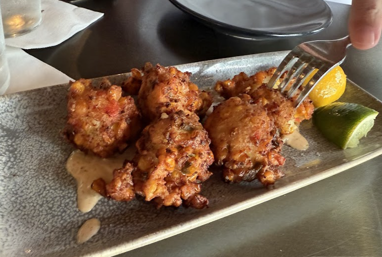 Stiltsville Fish Bar signature dishes Conch Fritters
Crispy Baked Tabasco Oysters
Roasted Whole Fish